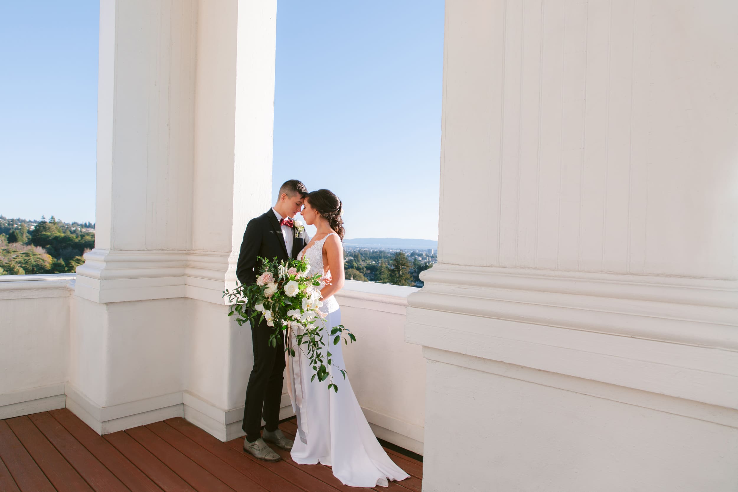 bride and groom outside on balcony