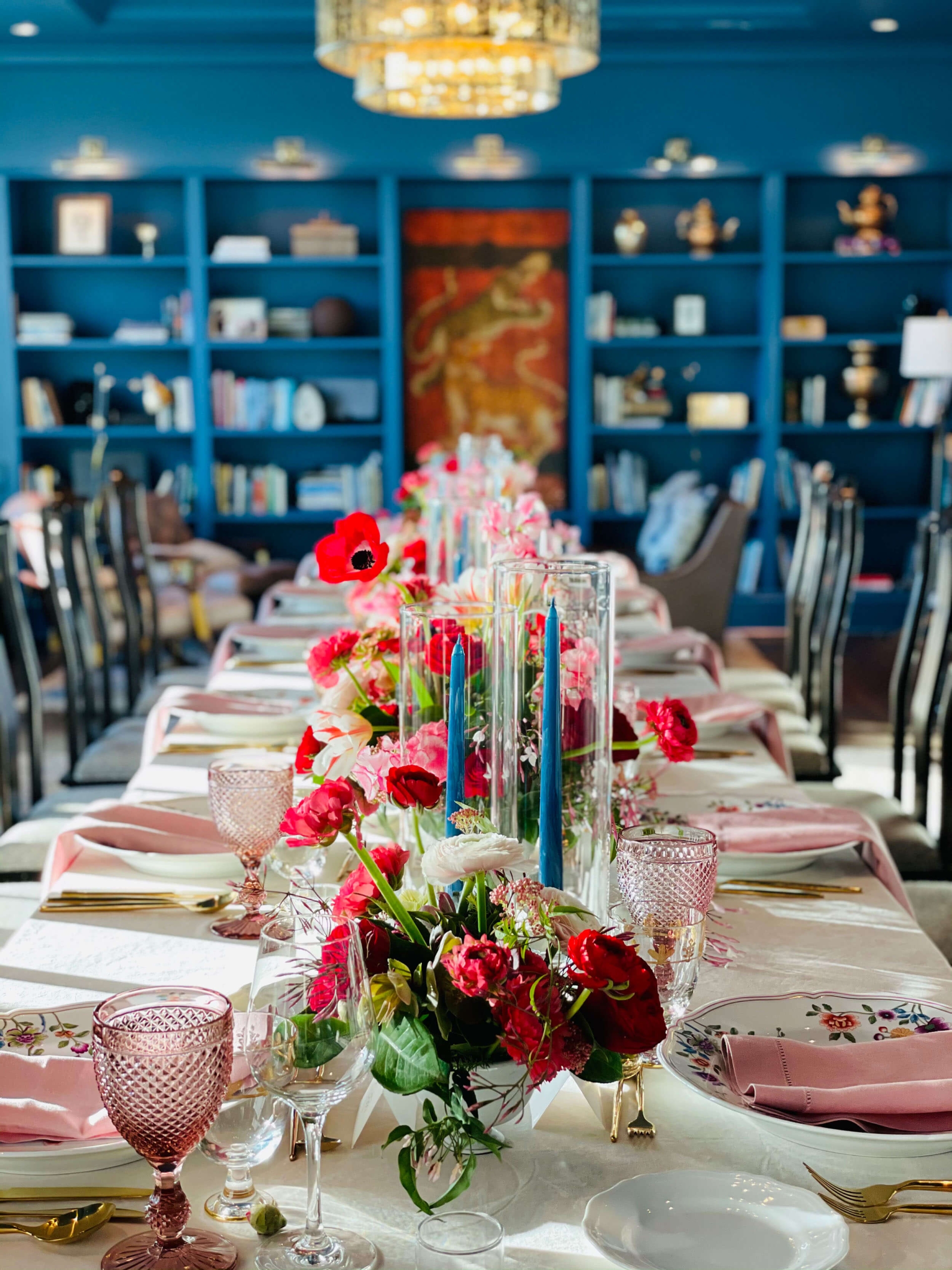long table set up with flowers and pink details